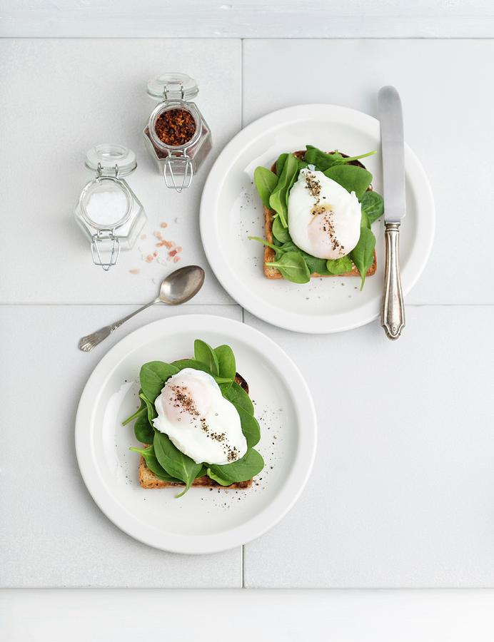Toast Topped With Young Spinach And Poached Egg Photograph by Komar