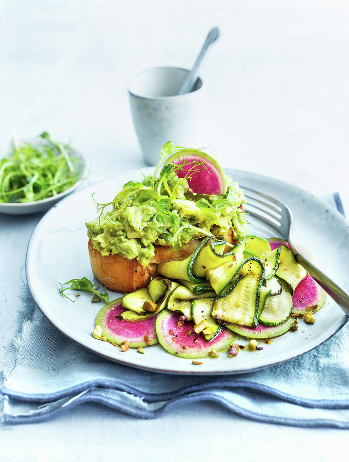 Toast With Avocado Pure, Courgette And Watermelon Radishes Photograph by Ira Leoni