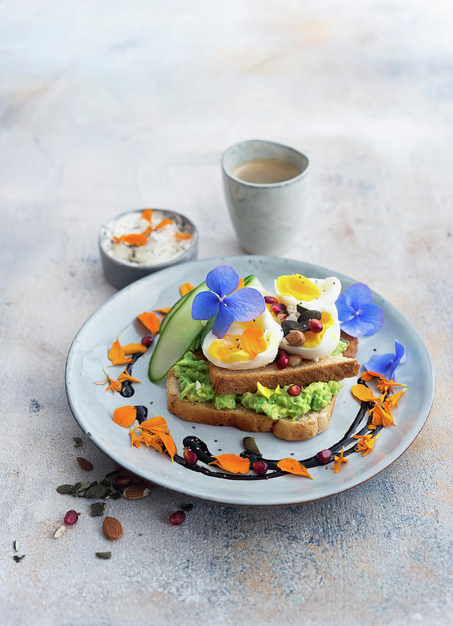Toast With Avocado Pure, Egg And Cucumber Photograph by Ira Leoni
