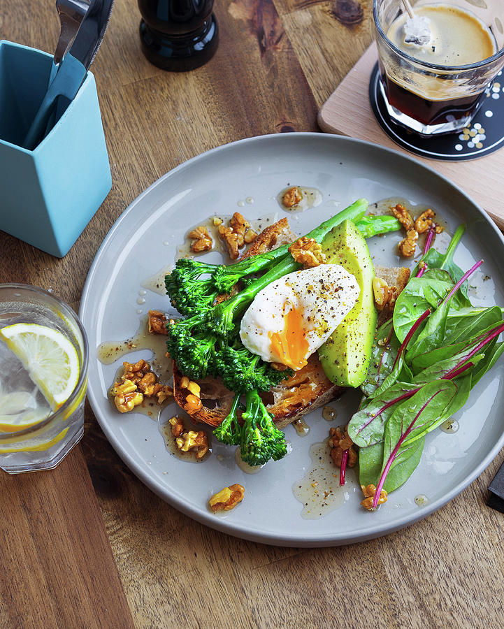 Toast With Broccolini, Poached Egg, Avocado And Walnuts Photograph by