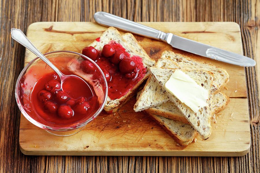 Toast With Cherry Jam And Butter Photograph by Rua Castilho