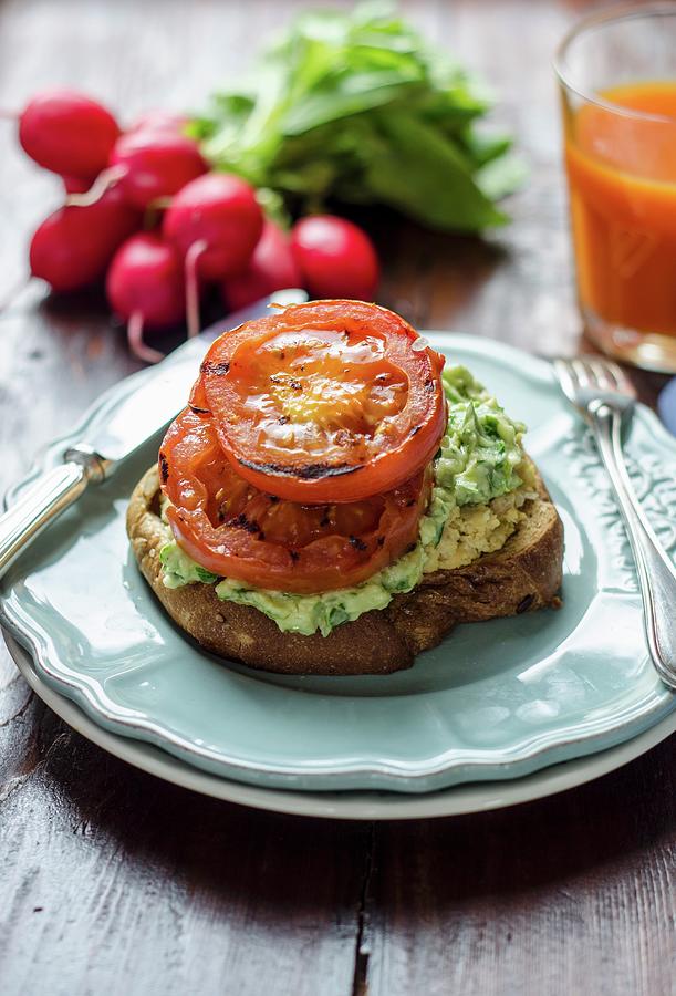 Toast With Chickpea Paste, Avocado Cream And Grilled Tomatoes Photograph by Aniko Szabo