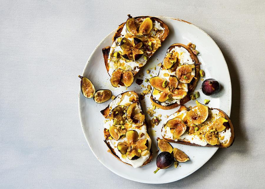Toast With Figs On Greek Yogurt With Chopped Nuts Photograph by Lisa Rees