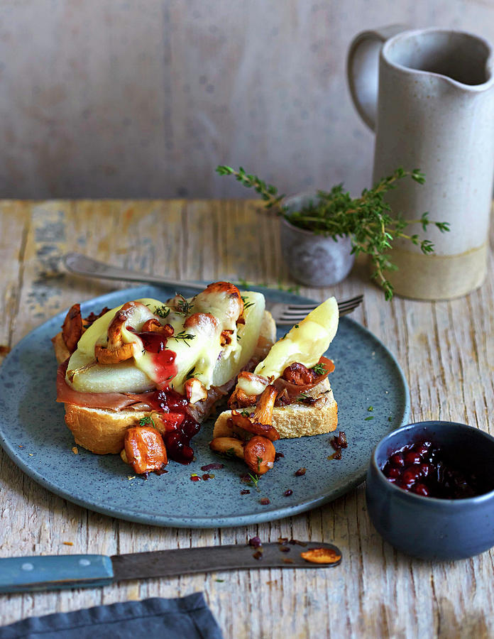 Toast With Pear Slices, Chanterelle Mushrooms And Alpine Cheese Melted On The Top Photograph by Jalag / Julia Hoersch