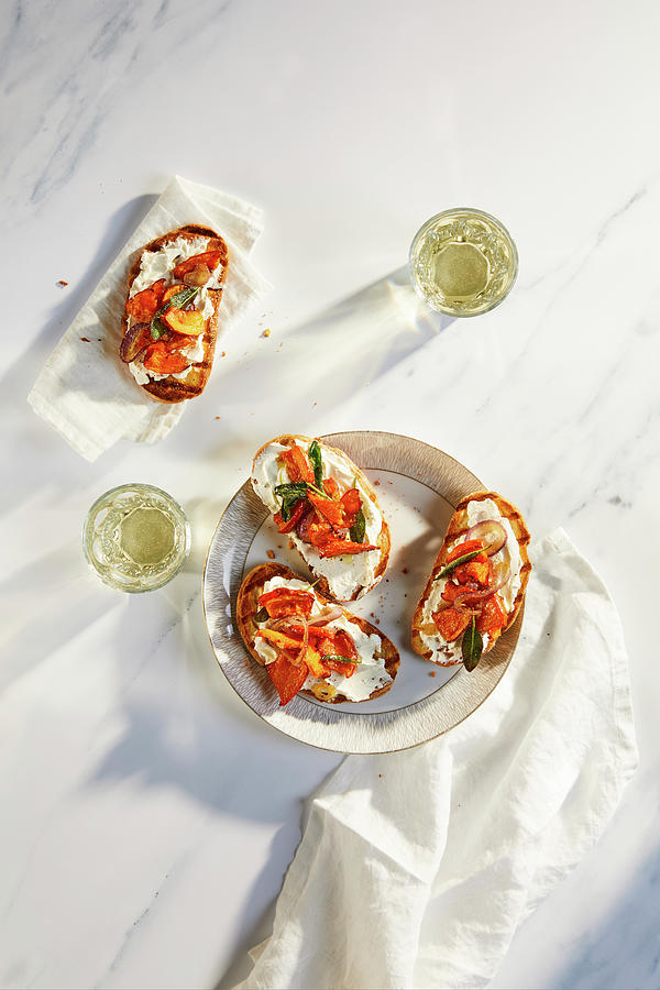 Toasted Baguette With Cream Cheese, Sage, Red Onions And Pumpkin Photograph by Jennifer Braun