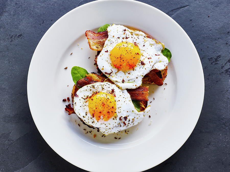 Toasted Bread With Bacon And Fried Egg Photograph by Mark Loader
