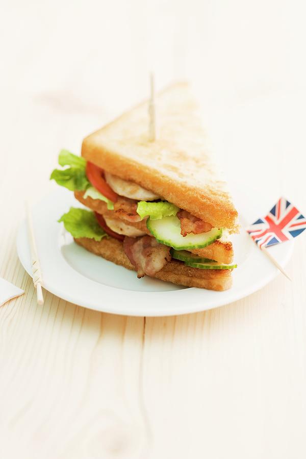 Toasted Club Sandwich With Bacon, Cucumber And Tomato england Photograph by Michael Wissing