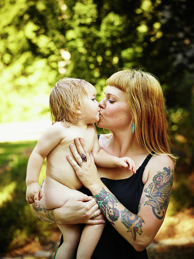 Toddler Daughter Being Kissed And Held Photograph by Thomas Barwick
