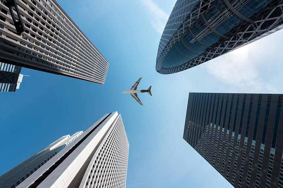 Architecture Photograph - Tokyo Skyscrapers Buildings And A Plane by Prasit Rodphan