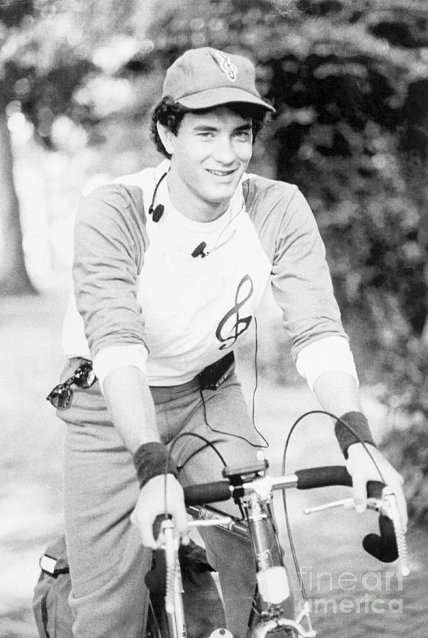 Tom Hanks Riding A Bicycle Photograph by Bettmann