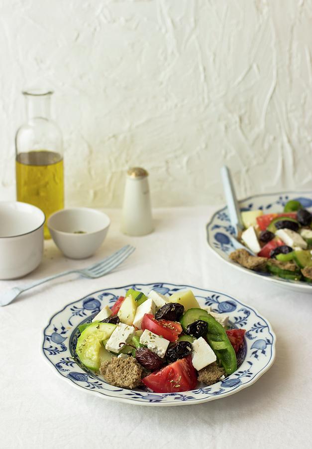 Tomato And Cucumber Salad With Zucchini, Potato, Green Pepper, Black Olives, Oregano And Farmhouse Bread crete Photograph by Zuzanna Ploch