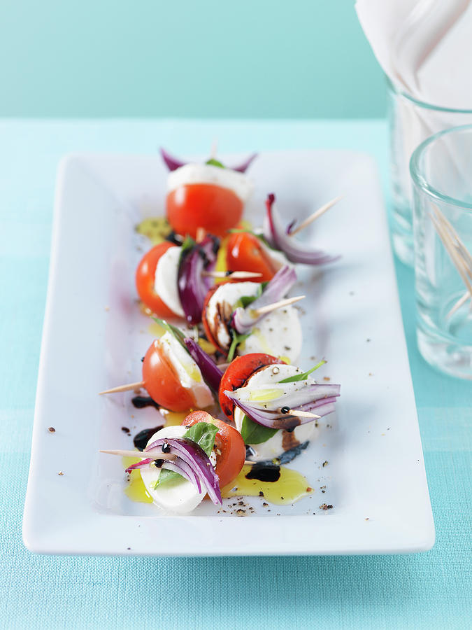 Tomato And Mozzarella Skewers With Red Onions And Basil Photograph by Andreas Thumm