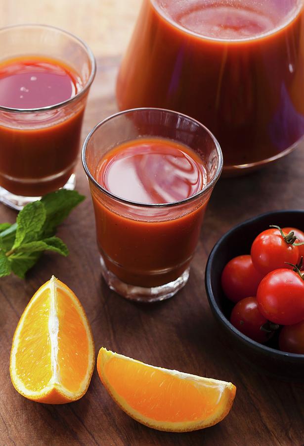 Tomato And Orange Juice With Ingredients Photograph by Nandita Shyam Sunder