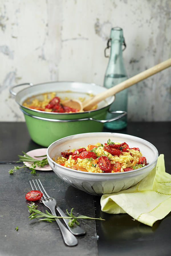 Tomato And Pepper Risotto With Parmesan Photograph by Ulrike Stockfood Studios / Holsten