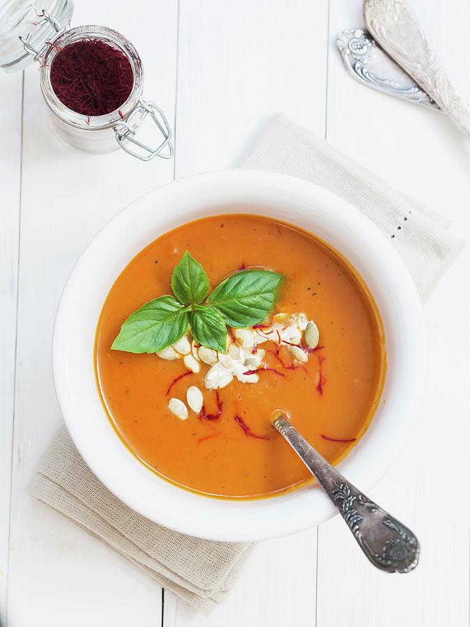 Tomato And Pumpkin Soup With Saffron In A White Bowl Photograph by Magdalena Paluchowska