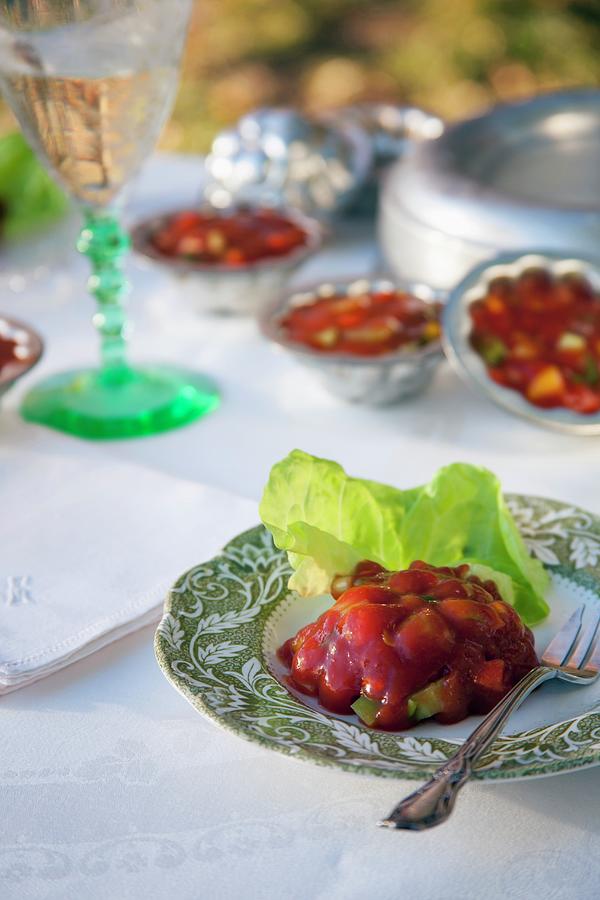 Tomato Aspic With A Lettuce Leaf On A Plate Photograph by Katharine Pollak