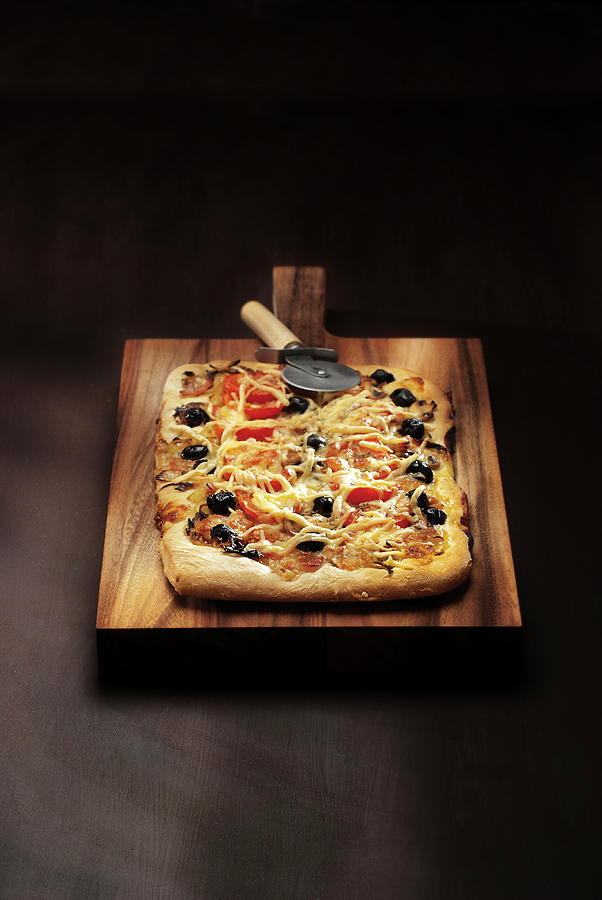 Tomato, Black Olive And Fromage Pizza Photograph by Perrin