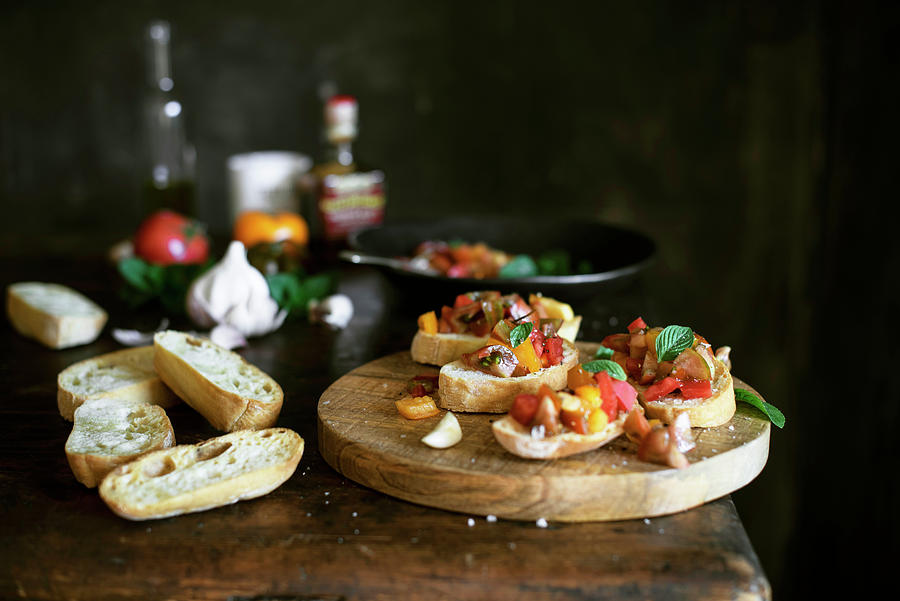 Tomato Bruschetta On A Wooden Surface Next To Ingredients Photograph by Justina Ramanauskiene