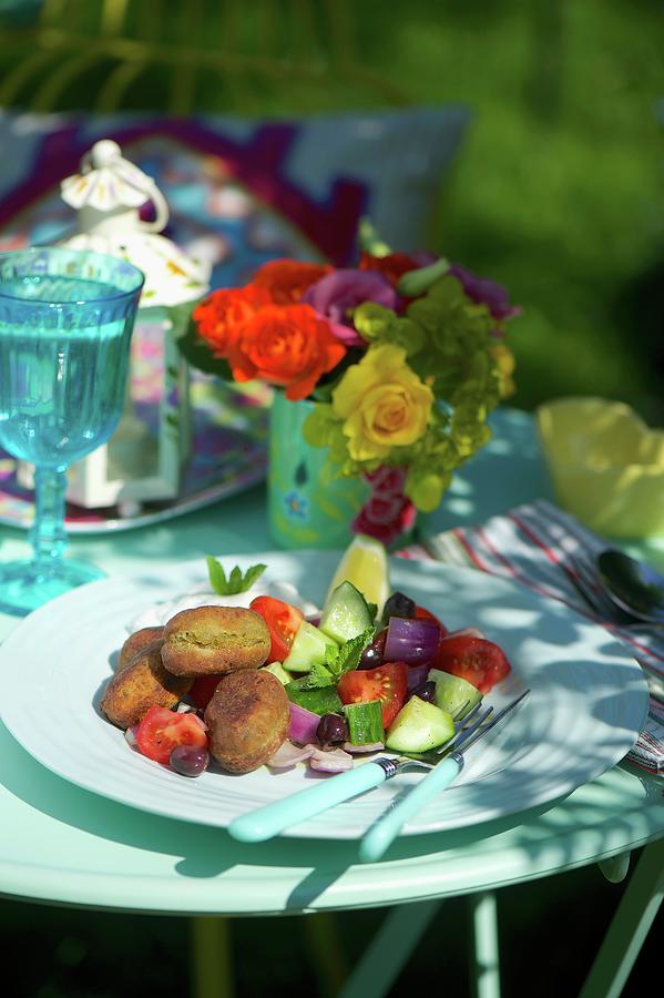 Tomato Cucumber Salad With Fried Chickpea Balls At A Summer Party Photograph by Winfried Heinze