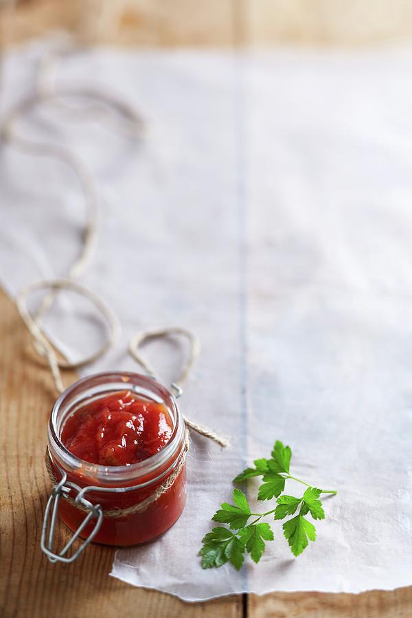 Tomato Relish In A Flip-top Jar On A Piece Of Paper Photograph by Great Stock!