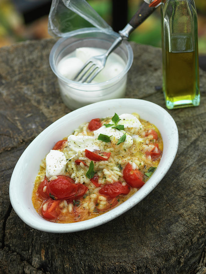 Tomato Risotto With Mozzarella And Basil Photograph by Andreas Thumm