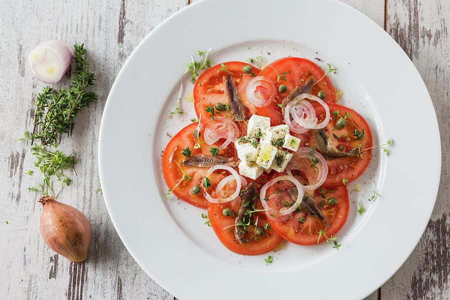 Tomato Salad With Anchovies And Feta Cheese Photograph by Jan Wischnewski