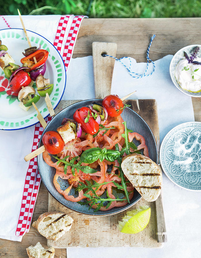 Tomato Salad With Rocket And Grilled Vegetable Skewers With Peppers, Red Onions, Feta Cheese And Cherry Tomatoes Photograph by Angelika Grossmann