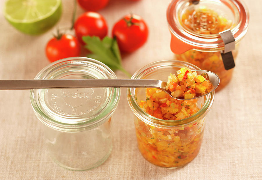 Tomato Salsa With Cumin In Jars Photograph by Teubner Foodfoto