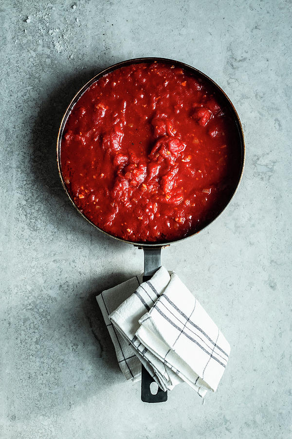 Tomato Sauce In A Saucepan Photograph by Simone Neufing