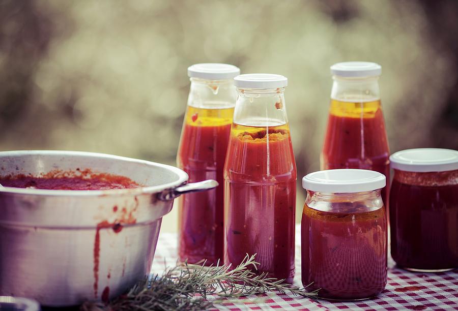 Tomato Sauce In Glass Jars And Bottles Photograph by Eising Studio