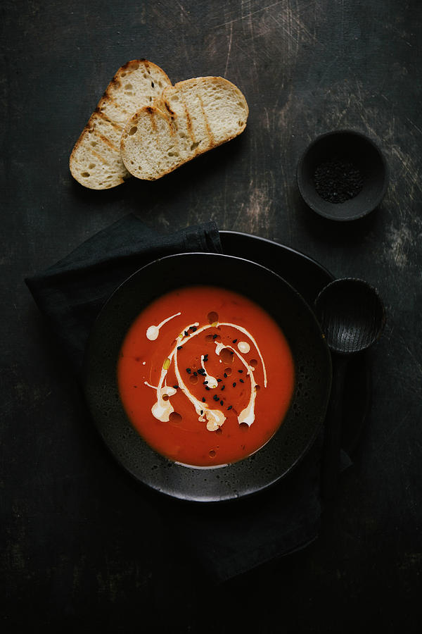Tomato Soup Garnished With Cream And Olive Oil With Toasted Bread Photograph by Valeria Aksakova