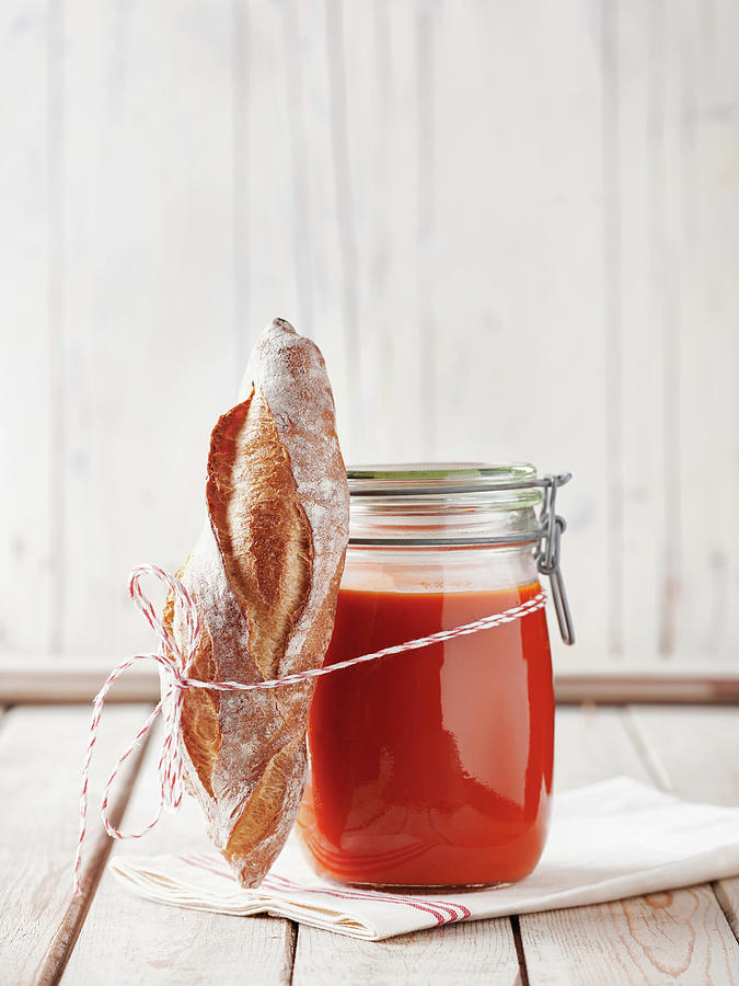 Tomato Soup In A Mason Jar With A Mini Baguette On A Napkin Photograph by Sylvia Meyborg