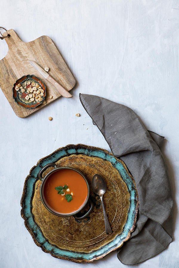 Tomato Soup On A Tray With A Bowl Of Hazelnuts Photograph by Lucie Beck