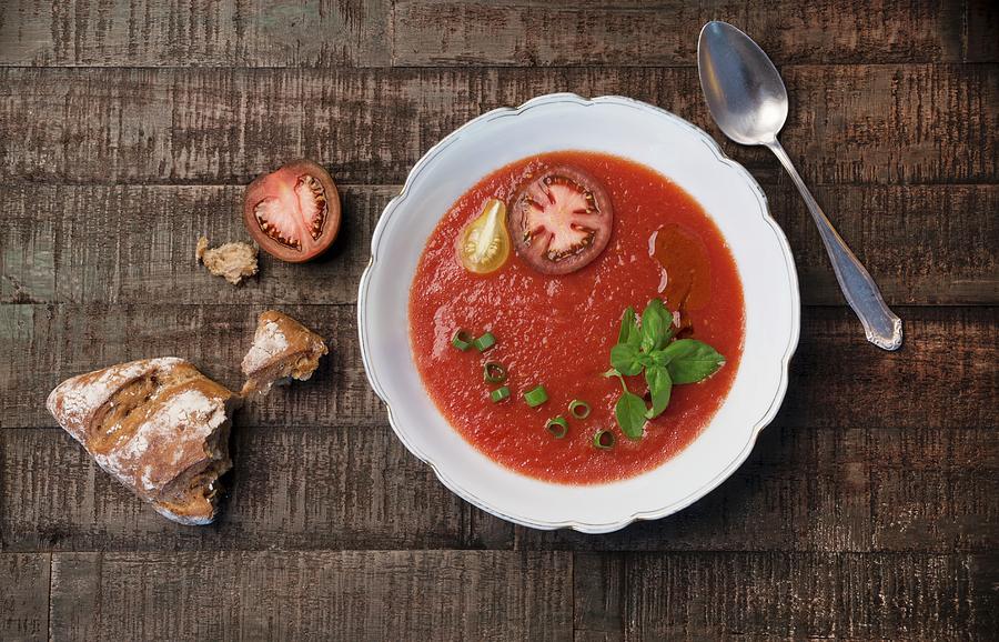 Tomato Soup With Spring Onions, Fresh Basil, Sliced Tomatoes And Olive Oil Photograph by Angelika Grossmann