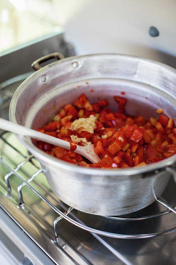 Tomato Sugo Being Made On A Camping Stove Photograph by Eising Studio