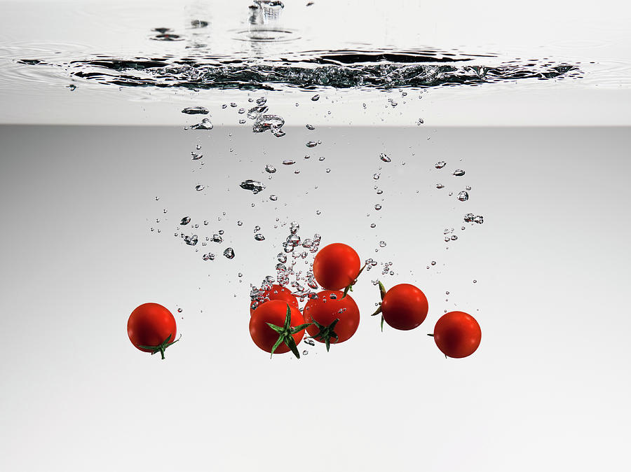 Tomatoes Falling Into Water Photograph by Pier