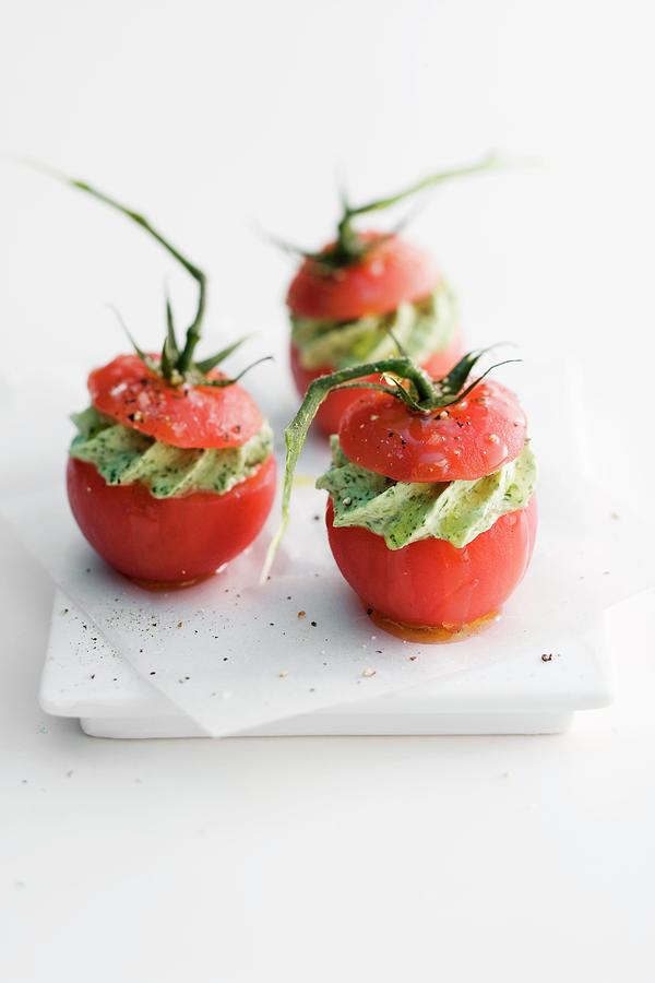 Tomatoes Filled With Pesto Cream Photograph by Michael Wissing