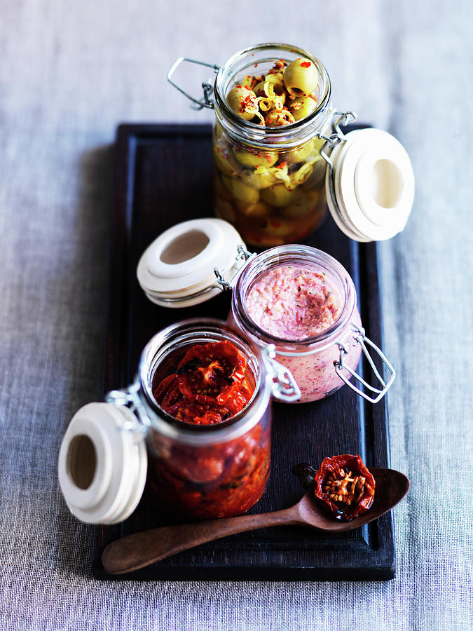 Tomatoes, Hummus And Preserved Olives In Flip-top Jars Photograph by Karen Thomas
