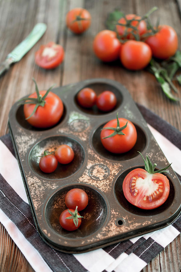 Tomatoes In A Metal Tray On A Wooden Background Photograph by Lieberbacken