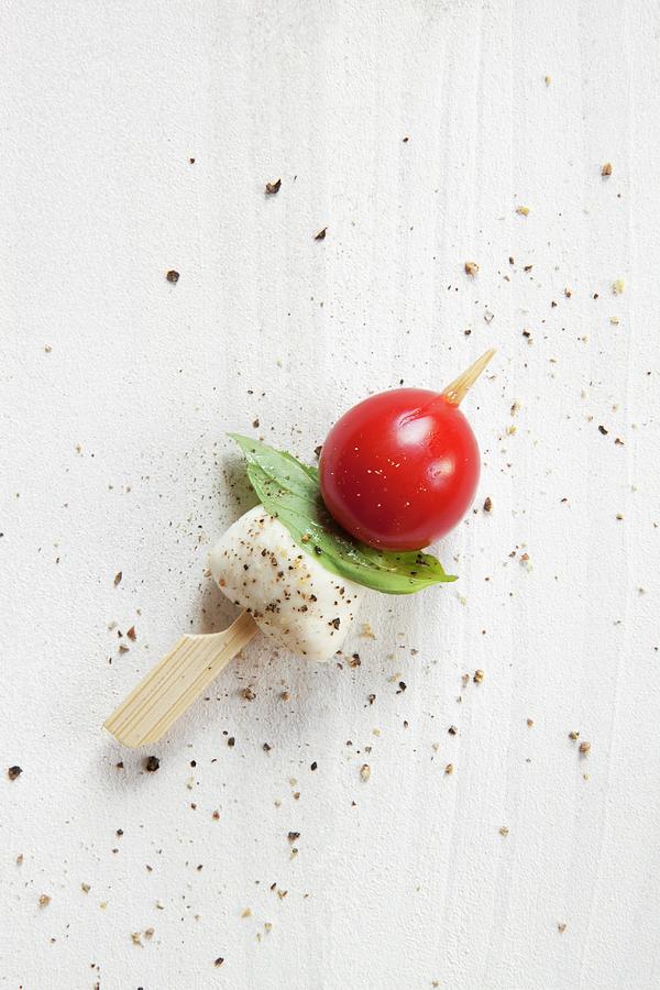 Tomatoes, Mozzarella And Basil On Cocktail Sticks Photograph by Younes Stiller