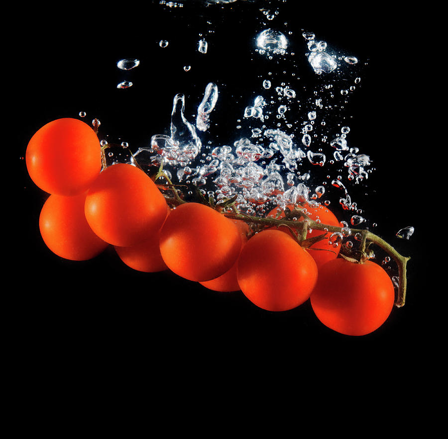 Tomatoes On The Vine Sinking Into Water Photograph by Henrik Sorensen