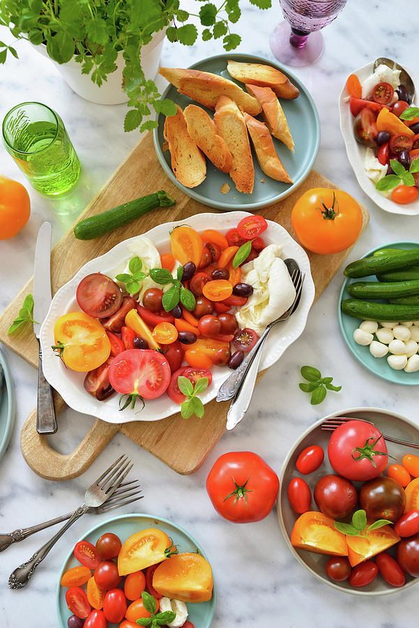 Tomatoes With Mozzarella, Burrata, Kalamata Olives, And Croutons. Italian Dinner Photograph by Karolina Smyk