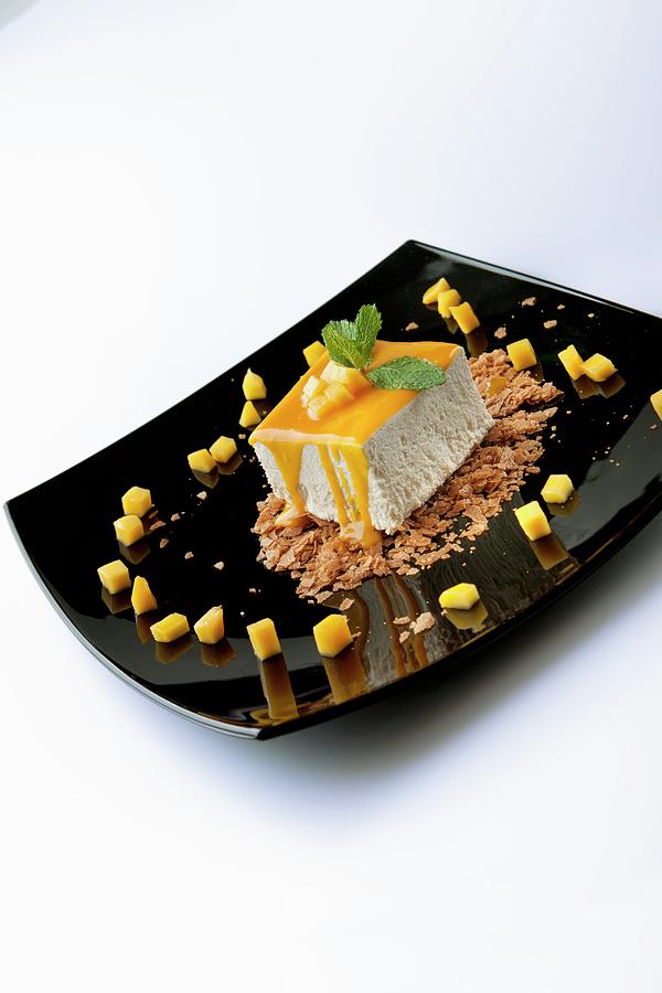 Tonka Beans With Mango Sauce And Diced Mango Photograph by Christophe Madamour
