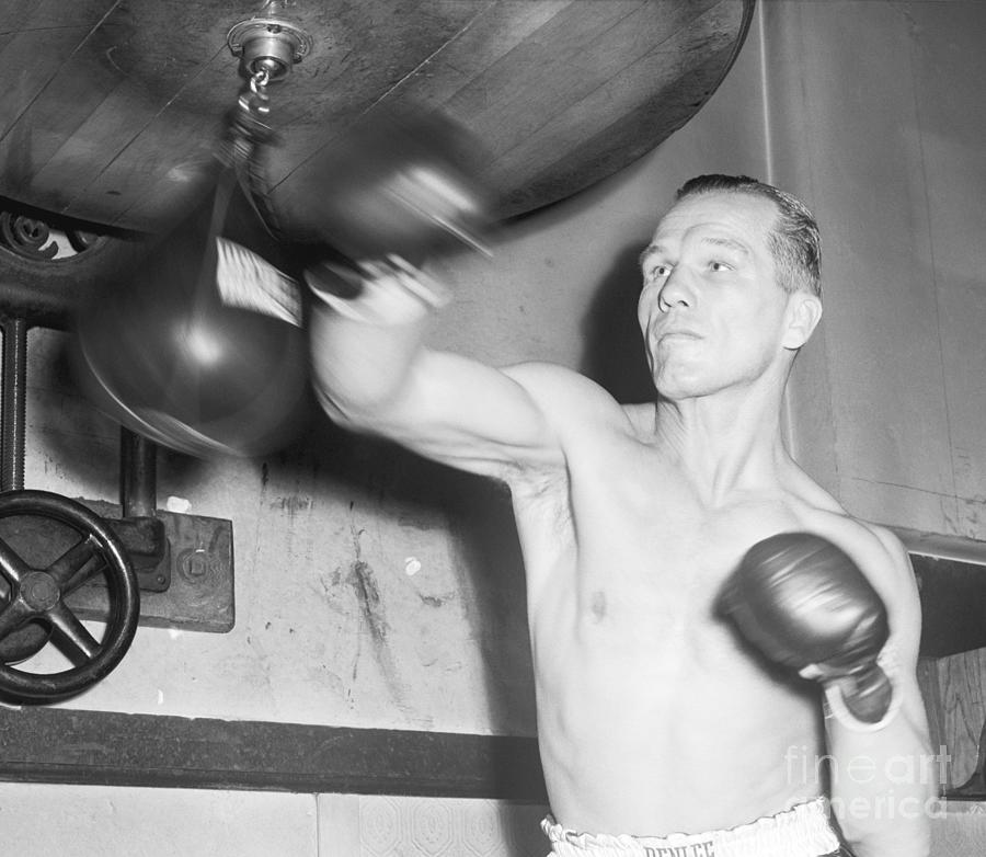 Tony Zale Punching Small Bag At Gym Photograph by Bettmann