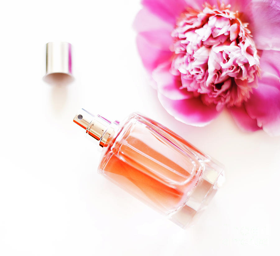 Flowers Still Life Photograph - Top view of luxury perfume bottle and pink peony flower on white by Jelena Jovanovic