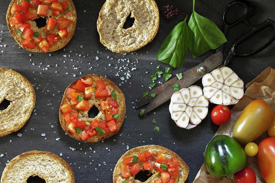 Top View Of Table With Italian Bruschetta On Frisella Bread, Seasoned With Fresh Tomatoes, Garlic, Olive Oil, Salt And Basil Photograph by Corina Daniela Obertas