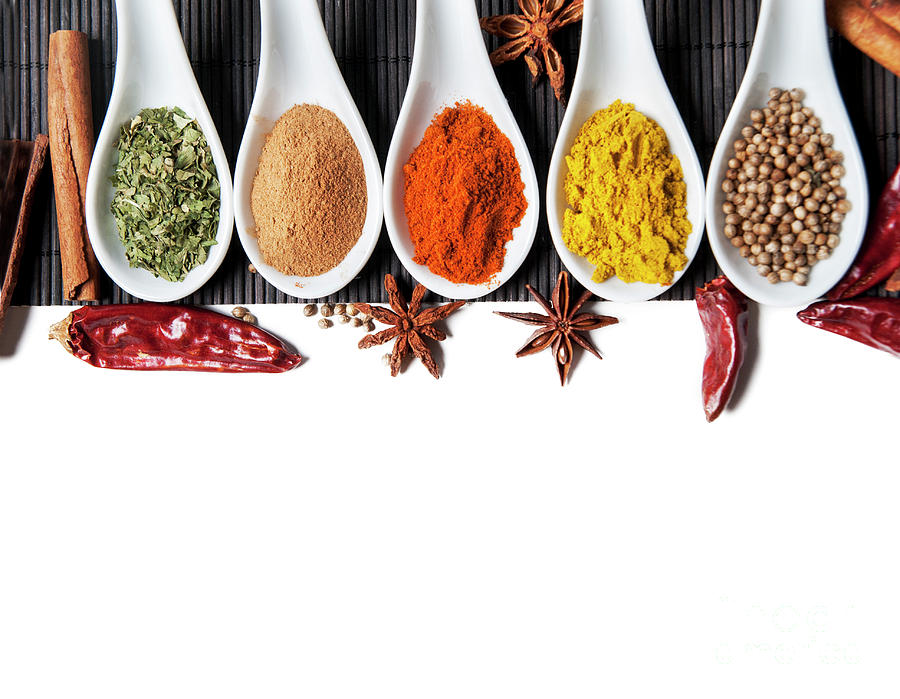 Top view on mixed dry colorful spices isolated on white backgrou Photograph by Jelena Jovanovic