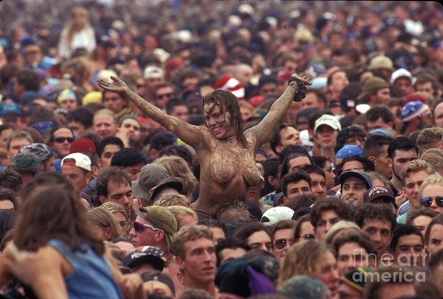 Topless Concert Fan Covered in Mud. 
