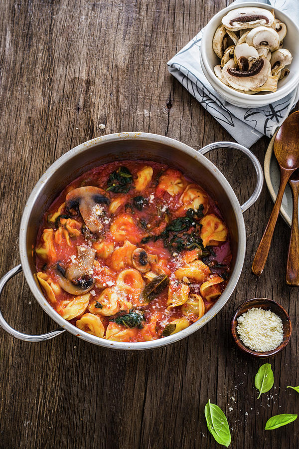 Tortellini In Tomato Sauce With Mushrooms And Black Cabbage Photograph ...