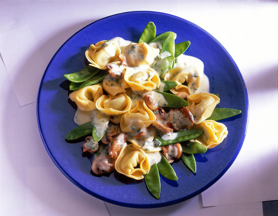 Tortellini With Mushrooms And Sugar Snap Peas On Plate Photograph by